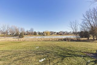 Large flat back yard to pond and walking trails