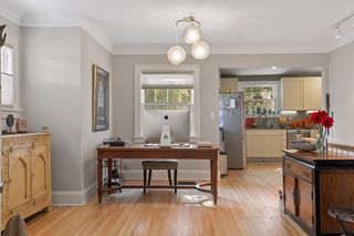 Open floor plan allows for either office space or formal dining