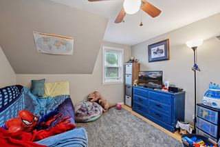 2nd bedroom on upper level. Features thermal pane windows, Bamboo flooring and ceiling fan.