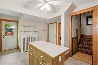 Spacious kitchen with breakfast bar and door to backyard!