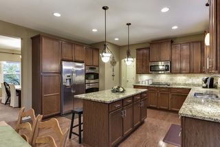Double oven, under cabinet lighting, and higher grade cabinets are a few of the nice touches this kitchen offers