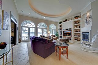 West facing great room with Marvin circle top doors to enhance the sunset views of Bald Eagle Lake.