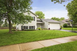 Spacious approach, black & white accents, grey maintenance free siding.