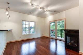 Balcony offers outdoor seating and views of the neighborhood.
