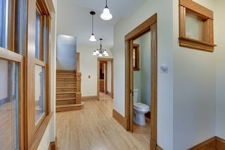 The Large, Entry Hall features Hardwood Floors, New Windows, Pendant Lighting & Half Bathroom...