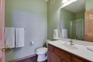 3/4 bathroom attached to main floor bedroom.