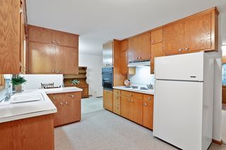 The Kitchen is full of natural light and wooded backyard views.  It has plenty of storage, counter space, and a serving island to the 
Dining Room for easy home entertaining.