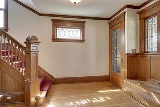 The Entry Hall features the Original Vestibule, Window Seat, Newel Post & Stunning Leaded Glass Windows! 