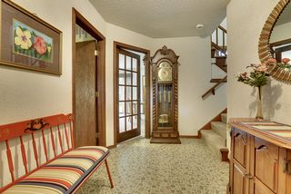 Another view from the front door: office/den to the left, family room straight ahead and living areas/kitchen up the stairs