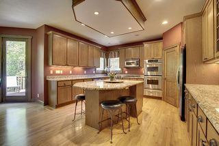 Undercabinet lighting, Stainless steel appliances, large corner walk-in pantry round out this space.