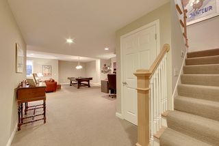 The lower level features two beds, one bath, and neutral decor.