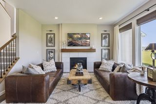 A great room perfect for the upcoming holidays with its ample space,
 large energy-efficient windows and a charming gas fireplace with wood mantle .