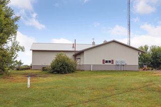 Pole shed features 32 x 40 shop with bathroom, heat and air conditioning.  40 x 72 storage area