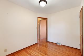 This bedroom on main level could be an office or dining room too!