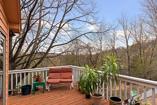Beautiful and private deck off sunporch - overlooking beautiful wooded lot...