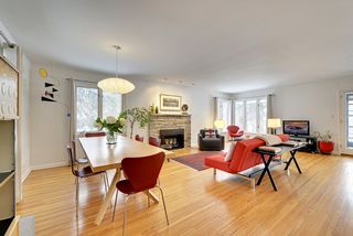 The Light-Filled Living Room features Hardwood Floors and a Gas Fireplace! 