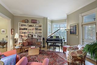 ...and entry out to the front screened porch for additional summer entertaining