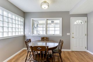 Bright and sunny informal eating area with new lighting