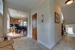 Tile entry wraps around to kitchen and stair locations.