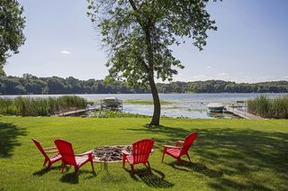 Large level yard includes a fire pit and garden spaces!