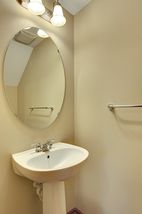 Powder Room conveniently located off of the Kitchen on the main floor