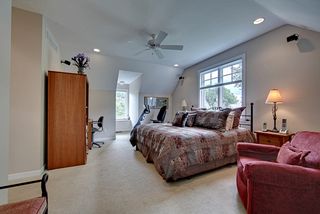 Owners suite tucked above the garage area flanked by dormers and large south facing windows.