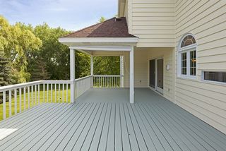 The covered deck area would be ideal for a rainy afternoon setting. This area could be easily screened off for a Screen Porch area as well.