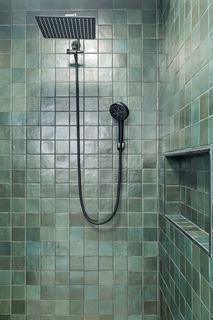4'x4' walk-in shower with rainfall shower head, luxurious sprayer and yeah, that's Zellige-look tile in a custom glass wall enclosure shower