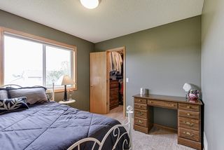 Second bedroom on upper level also has a walk-in closet