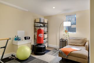 and an office/workout/storage space just begging to be finished as a fifth bedroom in the lower level ~ next to the three-quarter bath