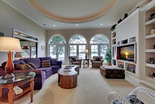Scalloped ceiling detail provides a soft glow of light in a beautiful room.