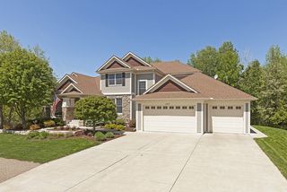 Classic styling, Interesting roof-lines with stone and horizontal siding compliments.