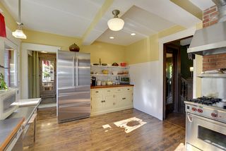 The Kitchen is a Chef's Dream! You'll find a WOLF Commercial Range and plenty of space for Informal Dining too! 