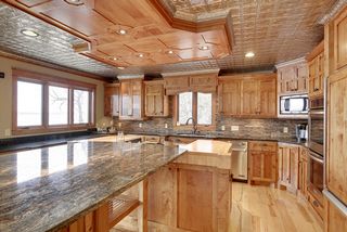 This is truly a kitchen that was designed for it's views and working spaces. Double Ovens, a Built-in Cooktop, and Microwave entice the culinary dreamers.