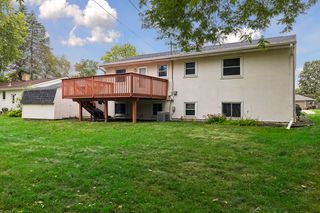 Spacious backyard with deck and storage shed