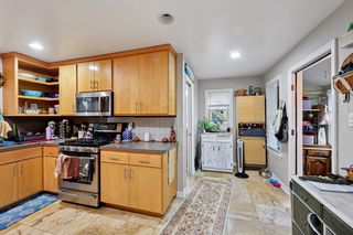 Another view of kitchen.
Updated kitchen features Stainless Steel appliances and Custom Maple cabinets, Travertine Tile flooring and a nook and cabinet for additional storage.