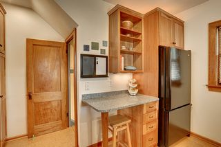 Large refrigerator/freezer, cook book display and home fix-it storage 