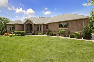 Timeless all brick front and end load garage