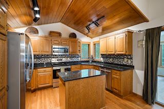 Kitchen w/ Granite and Stainless Steel