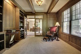 South facing windows with wood blinds bring in the natural light to this quiet space.