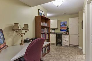 Desk area in the wide hallway in the basement leading to the lower level living room