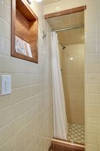 The Lower Level 3/4 Bathroom features this "Retro" Shower with original Ceramic Tile! 
