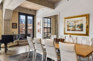 Direct access through French doors to a city view balcony.  All windows and doors have been replaced.