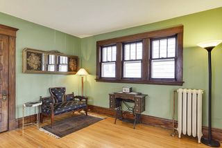 Front entrance with coat closet and gorgeous hardwood floors and woodwork.