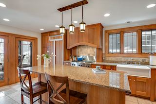 Renovated Kitchen with all the essentials for prep and entertaining around food. In floor radiant heat. Perfectly adjacent to the screend porch for summer dining 