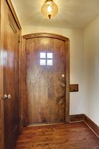 Entry views capture original woodwork, detailed trim and oversized moldings.