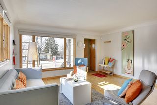 The Living Room features Hardwood Floors and the Entry Vestibule features original Tile Floors...