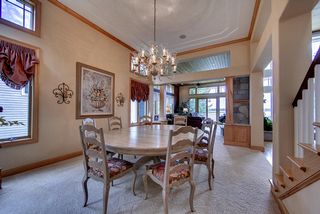 Dining area flows into great room and family room. Bald Eagle Lake in the distance.