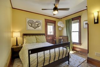 Bedroom #3 features Hardwood Floors and views of the Back Yard! 