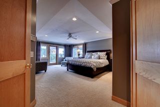 Owners suite, unique ceiling detailing, maple trim and 2 panel maple doors.